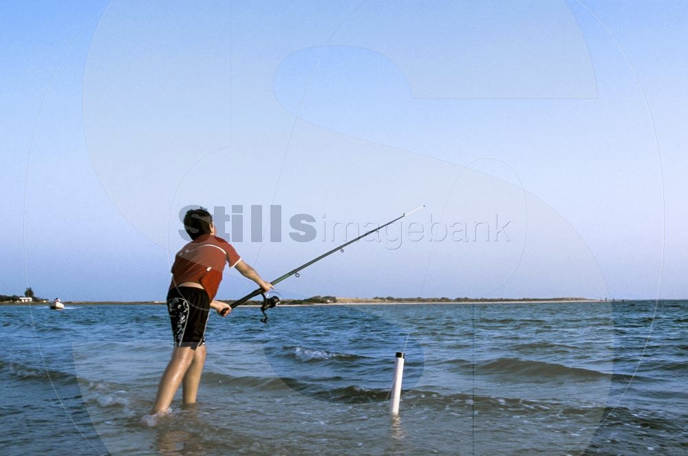 Boy fishing at Ria Formosa