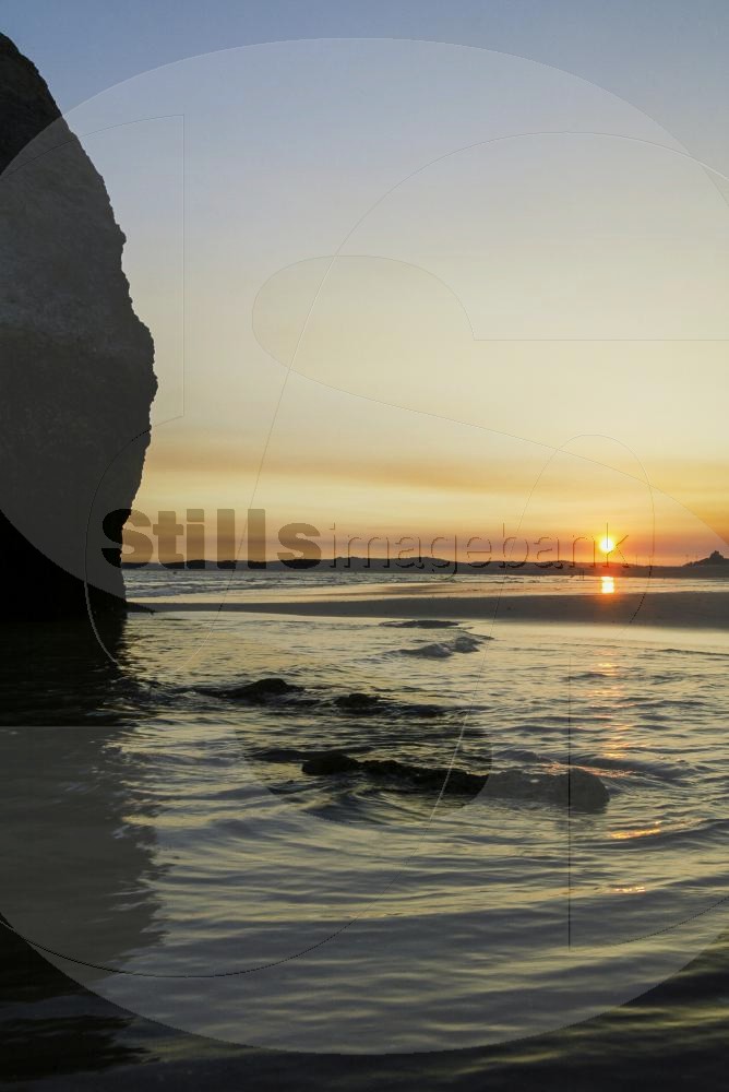 Sunset by the sea at the Alvor beach