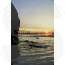 Sunset by the sea at the Alvor beach