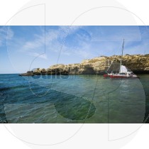 Catamaran next to the cliff